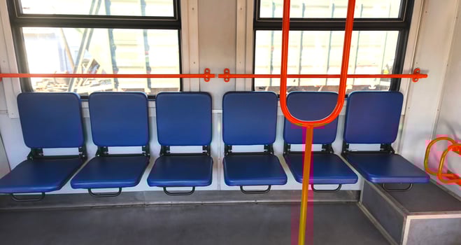 Empty carriage with blue seats of a city or intercity electric train. City transport, carriage interior photo