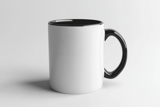 A white and black mug on a white surface photo