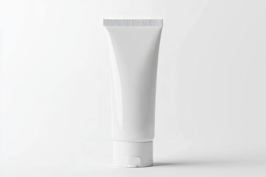 A tube of white cream on a white background photo