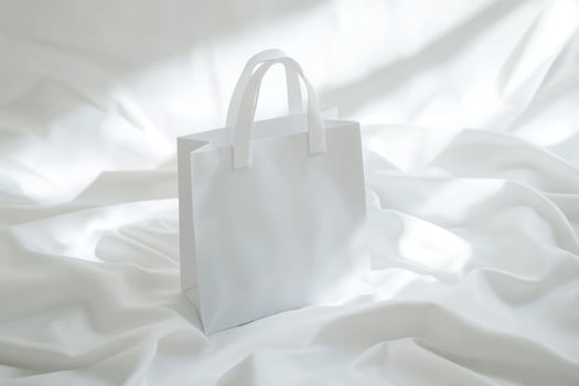 White paper bag on white background photo