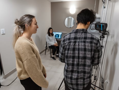 Film crew filming interview in small room. photo