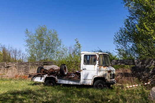 Abandoned truck on green grass. Poland photo