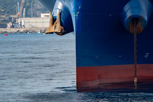 big ship with anchors prow detail outside the harbor photo