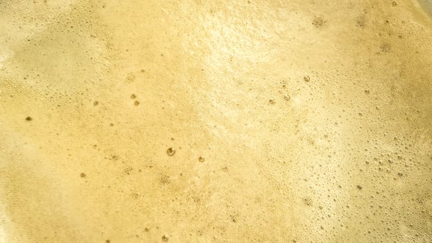 Effervescent champagne bubbles, golden sparkling wine close up, festive celebration moods, New Years Eve, luxurious party moments photo