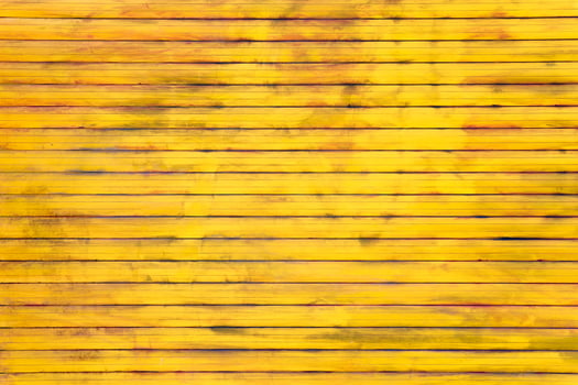 A yellow background with brown lines. The background is a bright yellow color, while the lines are a darker brown. The lines are scattered throughout the background, creating a sense of depth photo
