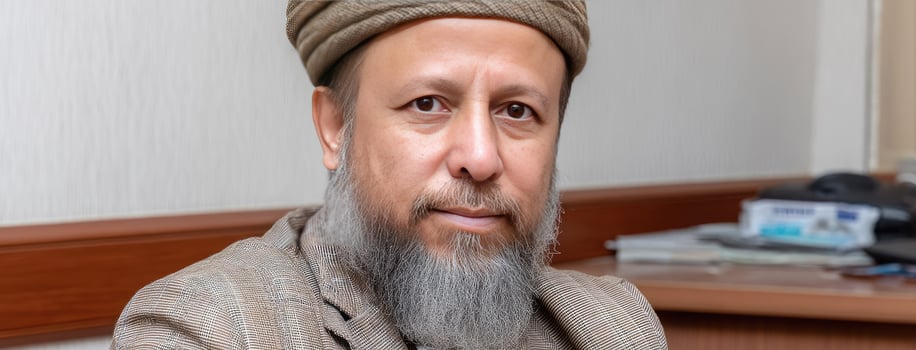 A man with a beard and a turban photo