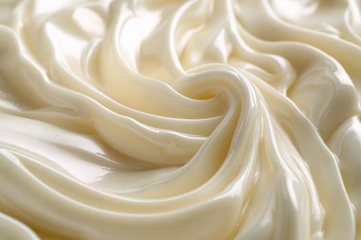 Creamy swirls of white cosmetic cream forming a smooth texture photo