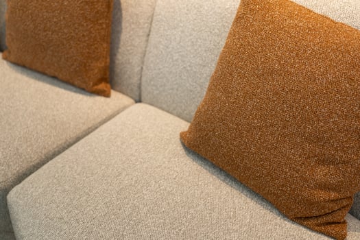 pillows on sofa in living room. close up home interior concept soft pillow in bedroom. home sweet home interior photo