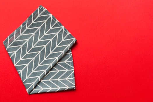 top view blue kitchen napkin isolated on table background. Folded cloth for mockup , Minimal style photo