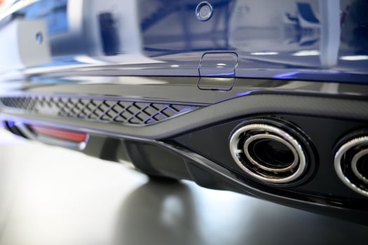 The exhaust pipes of a blue car photo