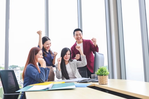 Cheerful Business Team Celebrating Success in Modern Office, Team Meeting and Brainstorming Concepts photo