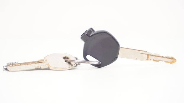 Black motorbike or motorcycle key isolated on white background photo