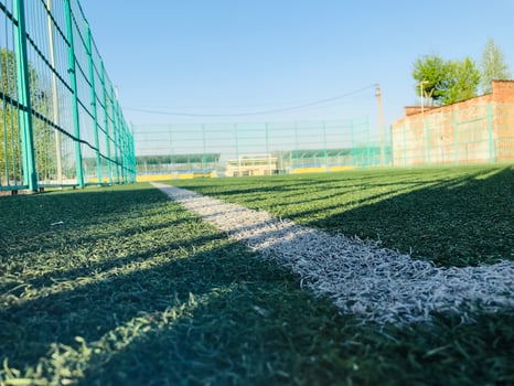 Empty sports field on a sunny day in a rural area photo