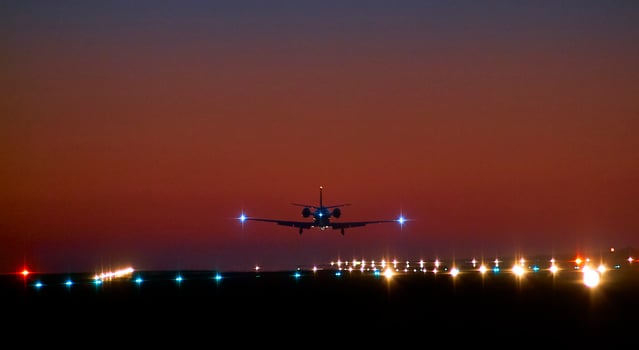 Airplane landing in the night photo
