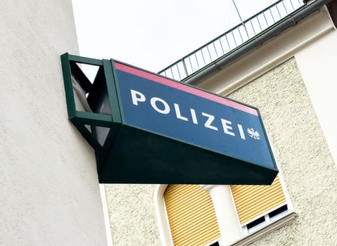 Police station sign on urban building exterior in germany photo