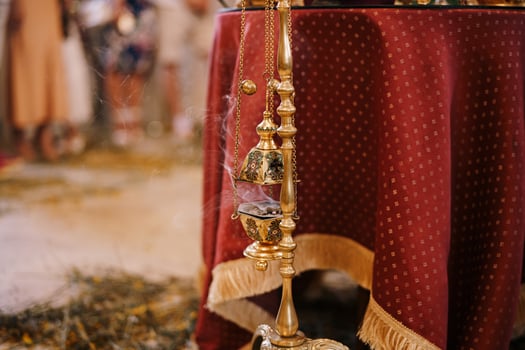 Elegant Brass Incense Holder with Smoke at Cultural Event photo