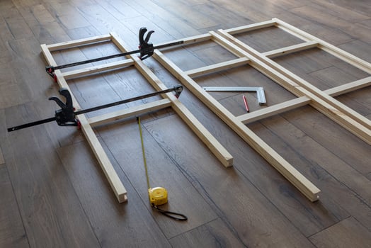 process of making a wooden rack, parts clamped with clamps, carpentry photo