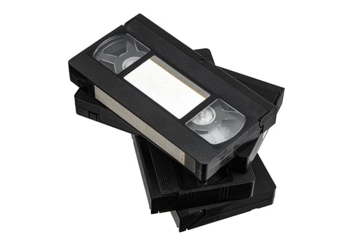 A collection of black VHS cassettes organized into a stack, highlighting their iconic retro design. photo