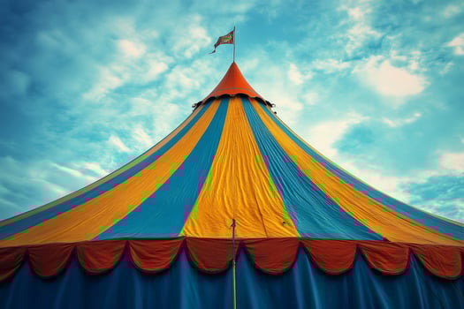 Colorful circus tent against dramatic sky photo