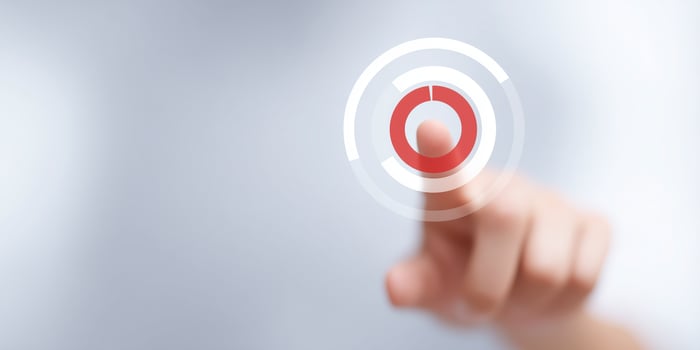 A person pressing a button on a white background photo