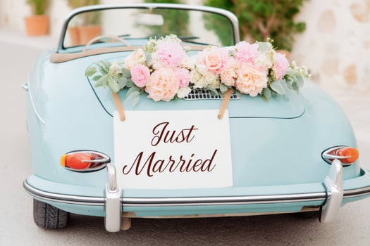 Vintage convertible adorned with flowers and a sign celebrating love, perfect for weddings and romantic occasions, symbolizing joy and new beginnings, wedding celebration concept photo