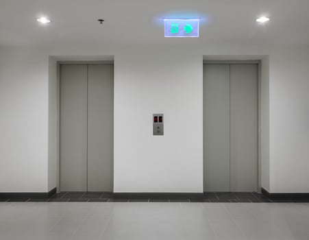 Two elevators with closed door photo
