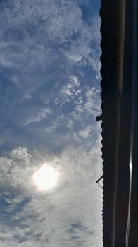 Sunny Day Sky View from Under a Roof photo