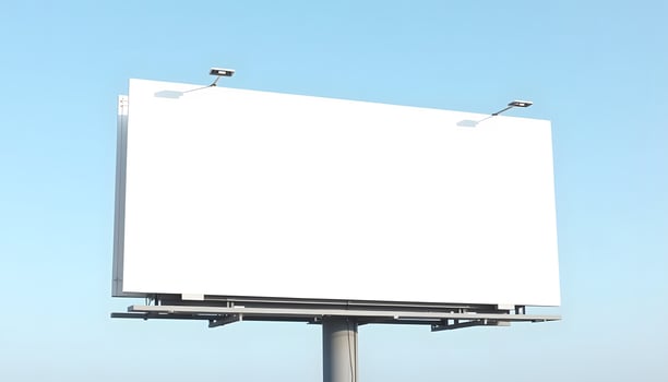 Blank Billboard Mockup A large, white billboard stands against a clear blue sky, ready for your advertisement. Perfect for design presentations or marketing campaigns. photo