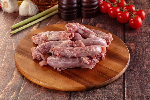 Raw pork on a wooden cutting board photo