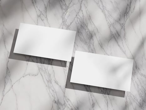Elegant and simple business card mockup on a marble surface, ideal for corporate presentations. photo