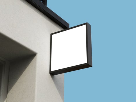 Contemporary logo sign mockup on a building wall with a sleek square frame, ideal for branding. photo