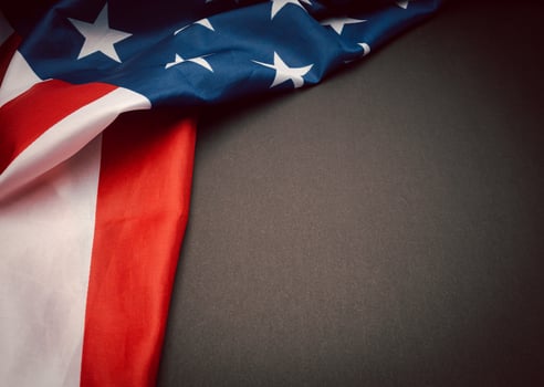 Part of the American flag is on a dark background. Space for text. photo