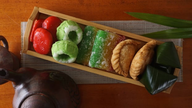 Various traditional market snacks from Indonesia or jajanan pasar in wooden tray photo