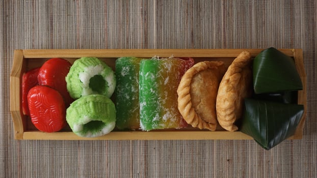 Indonesia traditional market snacks or jajanan pasar in wooden tray photo
