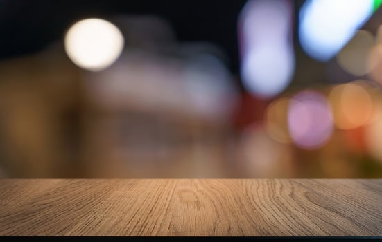 Empty wood table top and blur of restaurant background selective display photo