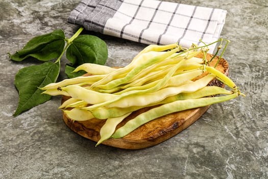 Fresh green beans on a wooden board photo