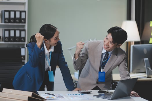 Two business people in an office setting photo