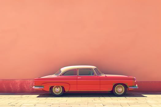 stylish image of parked classic red retro car parked near pink wall on sunny day with copy space photo