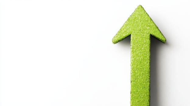 A green arrow pointing upward on a white background photo