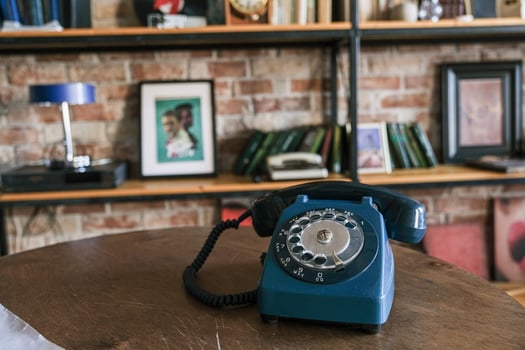 Moscow, Russia, 14.07.2025 Old disk phone on background of book shelf photo