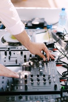 Disc Jockey Mixing Music at a Live Entertainment Event photo