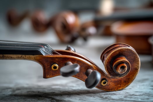 Classical violins lying on textured stone ground photo