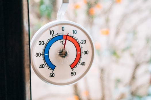 The outdoor thermometer is displaying various temperature readings photo