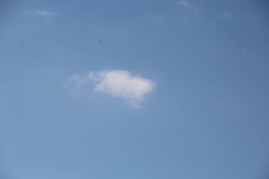 a white cloud in the sky photo