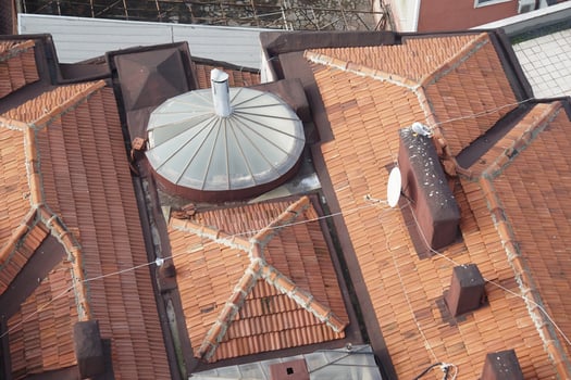 Unique rooftops of an urban building in a residential area photo