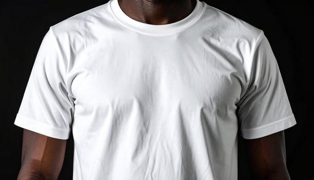 White T-Shirt Isolated on Black Background photo
