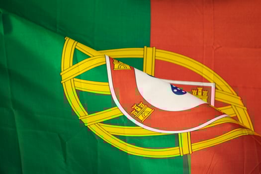 close-up view of the coat of arms on the portuguese flag detail view of the flag of portugal and national emblem photo