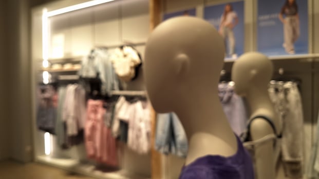Moscow, Russia - April 26, 2025.Mannequins in fashion retail store display with blurred clothes background photo