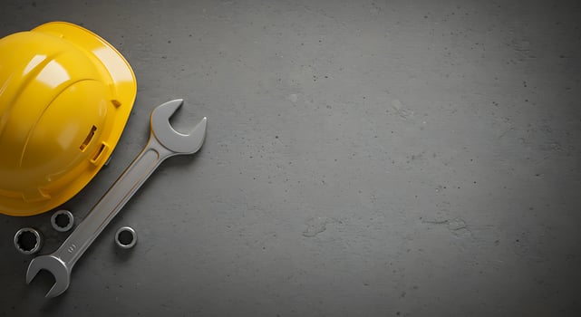 Construction Safety. Hard Hat, Wrench, and Tools on Gray Background photo