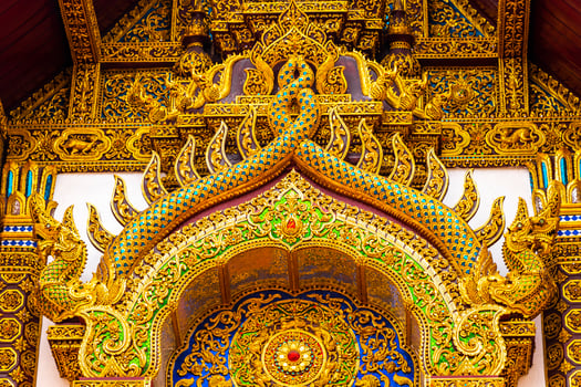 A golden and blue door with intricate designs photo